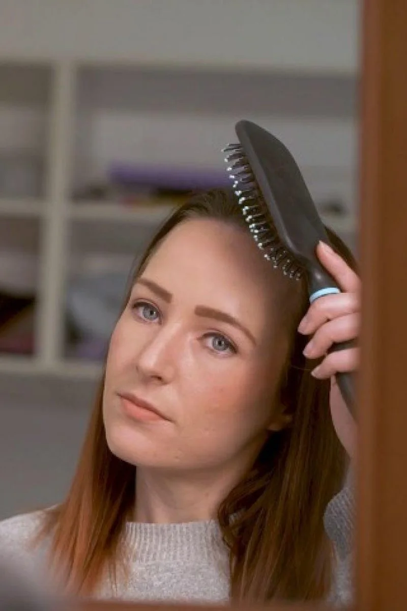 Brunette Brushing Her Hair