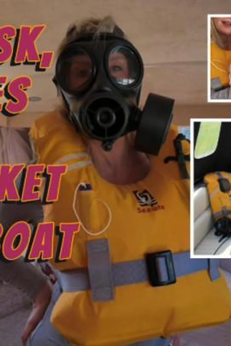 Gas Mask Wellies & Life Vest On The Boat