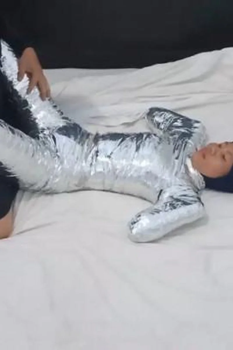 Girl Mummified With Chrome Tape Like A Pet